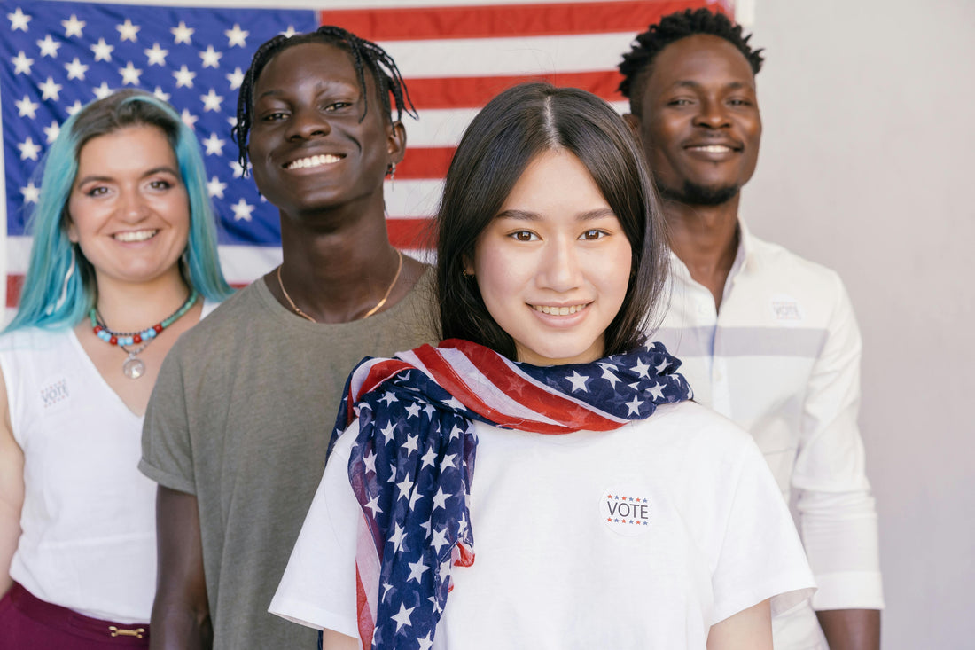 Young people of diversity in front of an American Flag